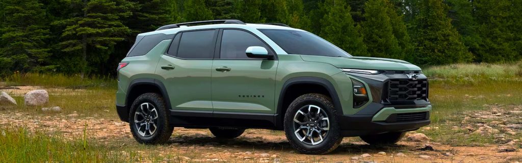 The image shows a green Chevrolet Equinox SUV parked off-road in a forested area.